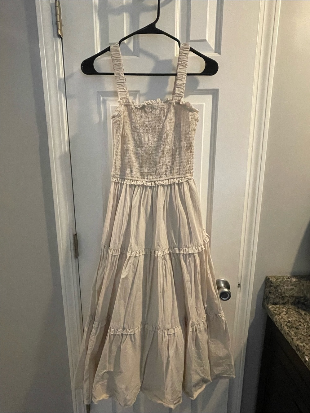 Smocked Tiered Maxi Dress with ruffled accents.